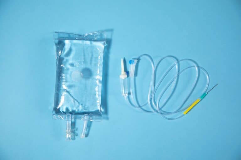 Infusion,Bag,In,The,Blue,Background.,Iv,Drip,Chamber